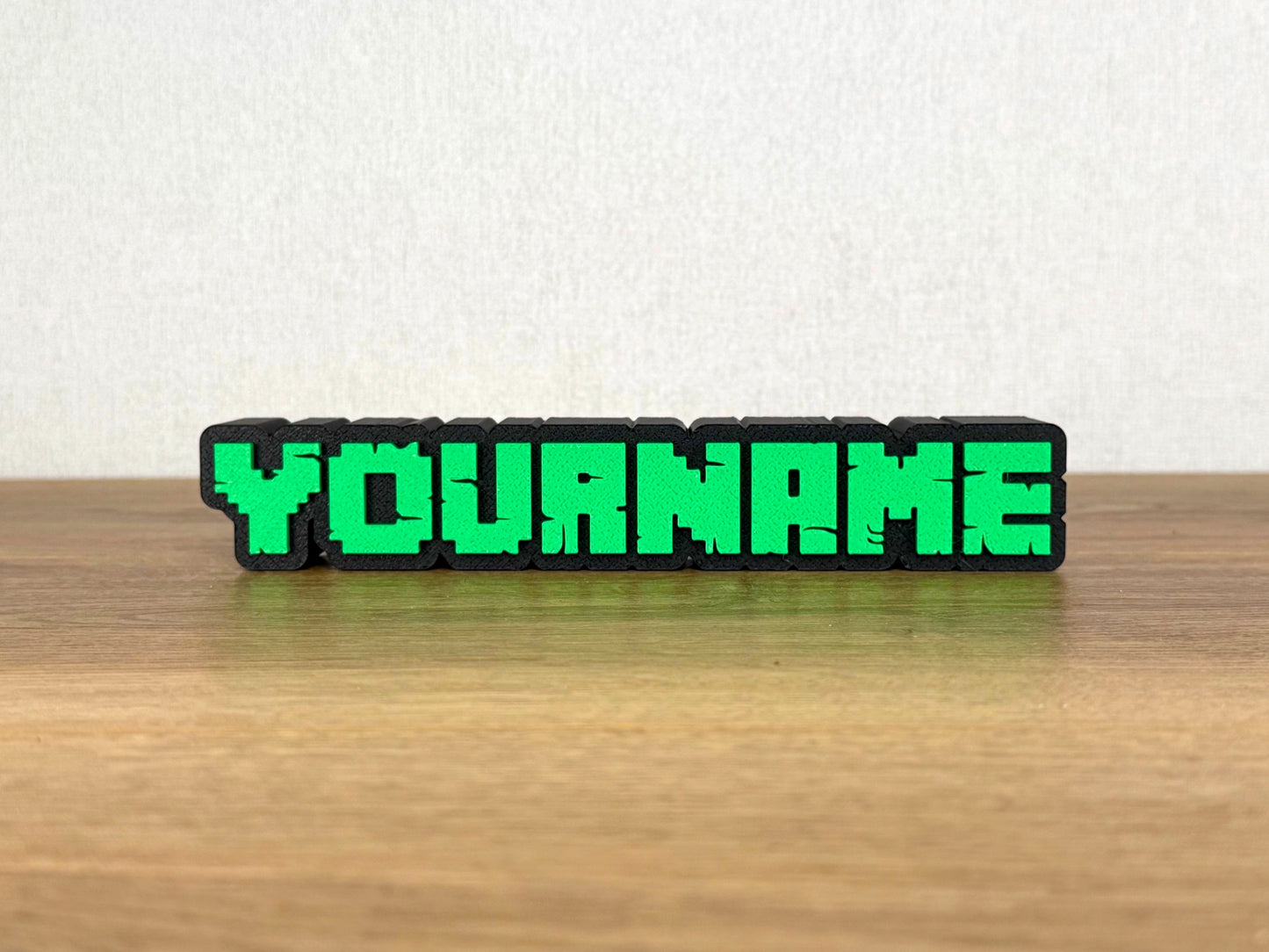Picture of a minecraft video game name sign on a desk or bedroom table